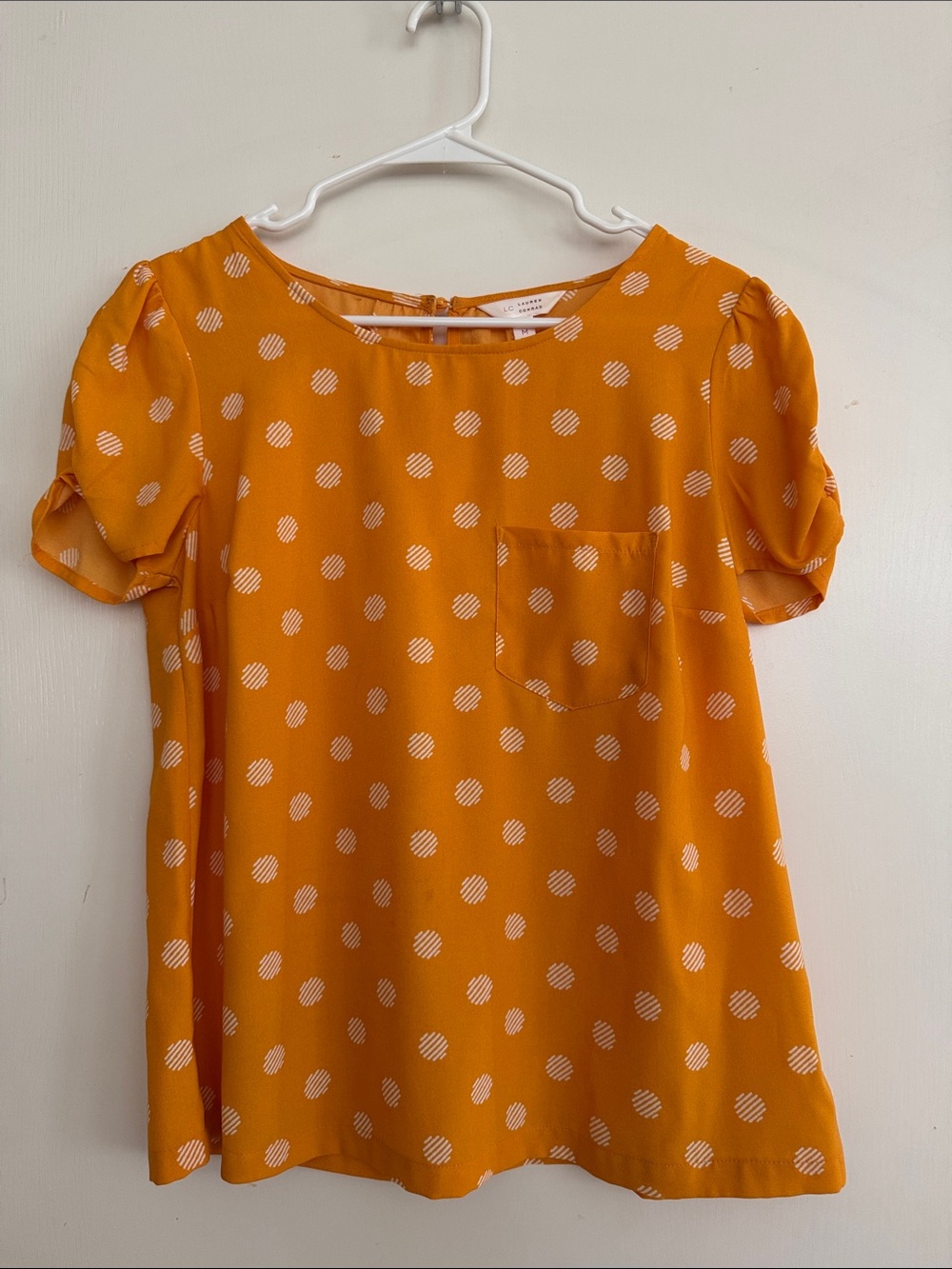 LC Lauren Conrad Polka Dot Orange Blouse with Ruched Sleeves and Front Pocket
